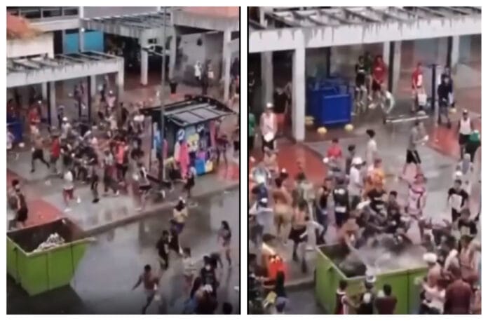 ¡SOLO EN VENEZUELA! Jugando a carnaval meten a joven en un contenedor de basura causando indignación (VIDEO)
